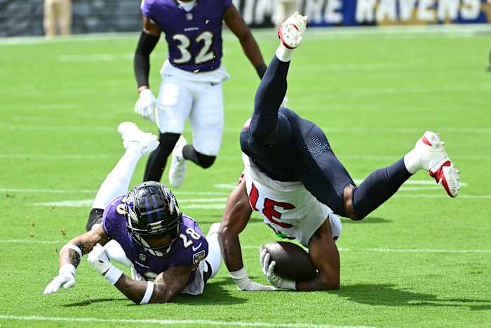 Sep 10, 2023; Baltimore, Maryland, USA; Houston Texans running back Dameon Pierce (31) is tackled by Baltimore Ravens cornerback Ronald Darby (28) during the first half at M&T Bank Stadium. Mandatory Credit: Brad Mills-USA TODAY Sports 